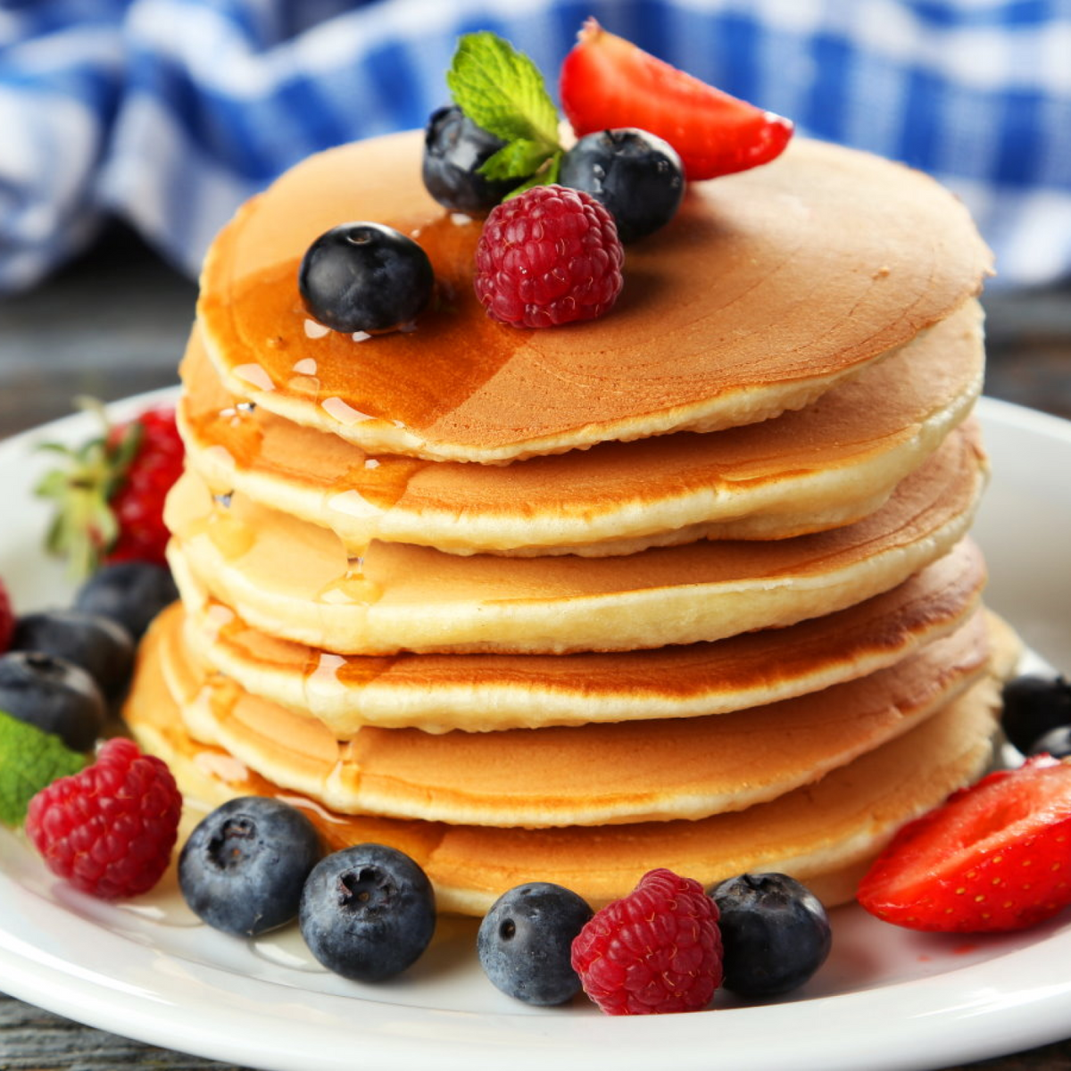 Pancake with honey syrup and organic berries