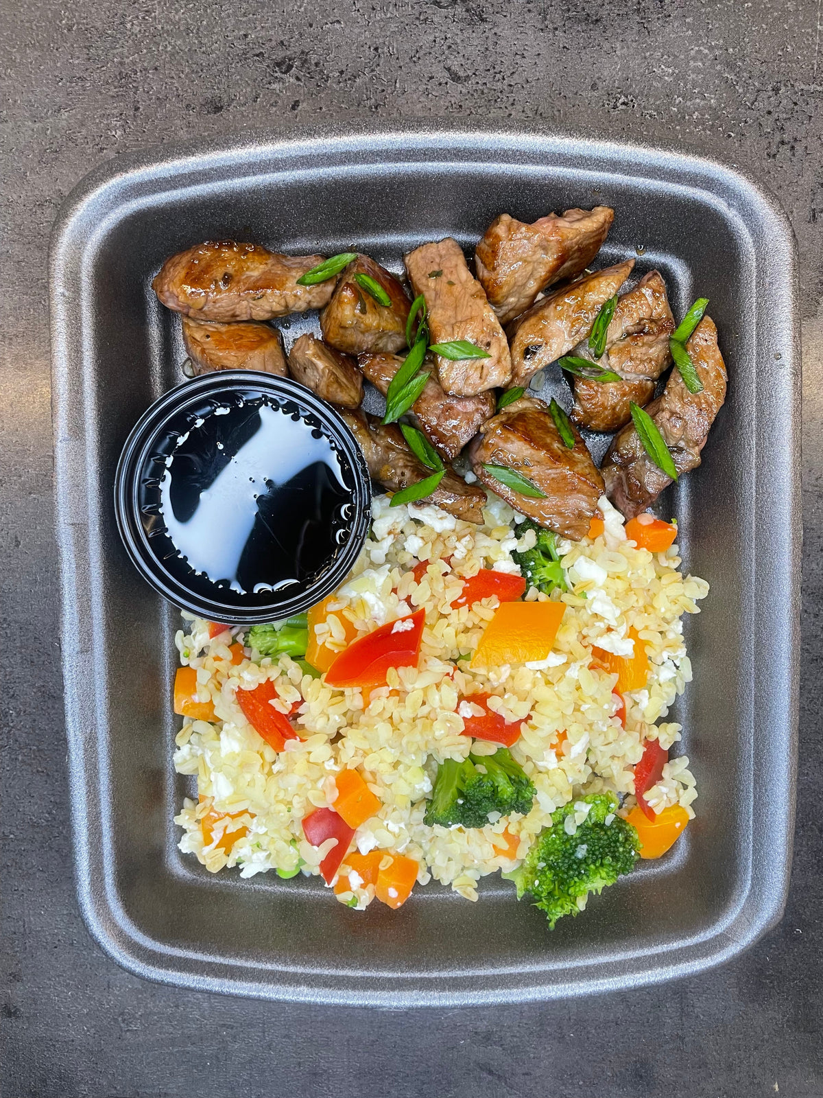 Dinner / A blend of brown rice broccoli and beef filet